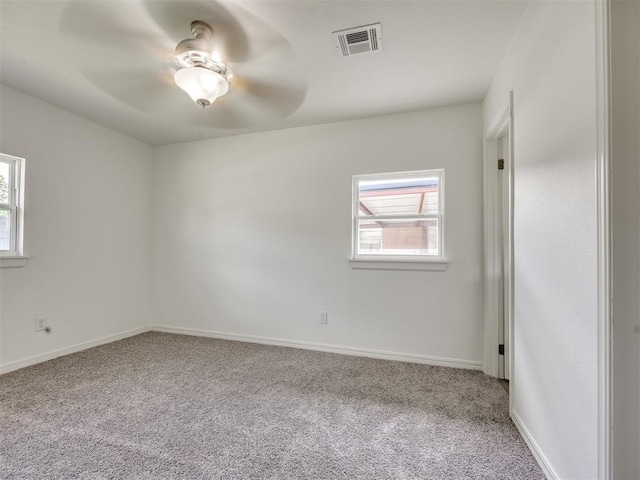 3044 S Madole Blvd, Oklahoma City, OK 73159 - spare room featuring carpet floors and a ceiling fan