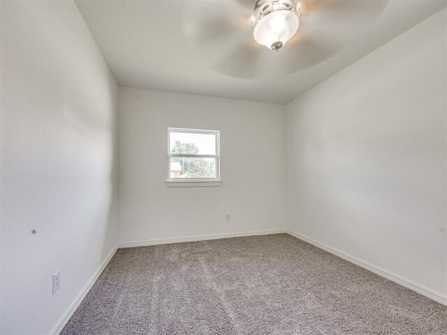 3044 S Madole Blvd, Oklahoma City, OK 73159 - carpeted empty room featuring baseboards and a ceiling fan