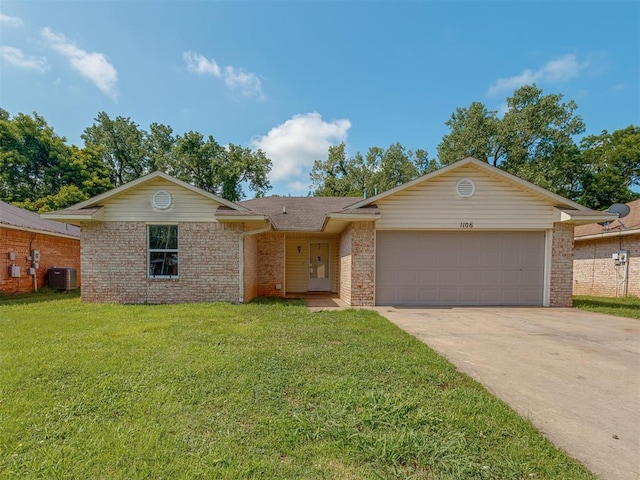1106 Foggy Bottom Rd, Tecumseh, OK 74873 - view of front of property with an attached garage, brick siding, a front lawn, and driveway