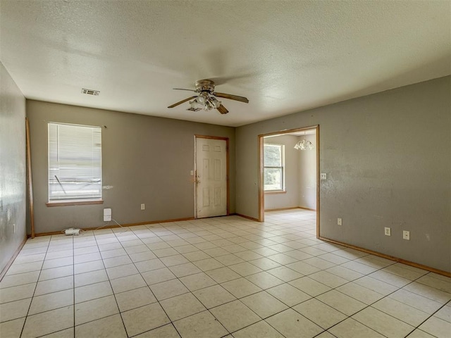1106 Foggy Bottom Rd, Tecumseh, OK 74873 - spare room with a ceiling fan, a textured ceiling, and light tile patterned floors