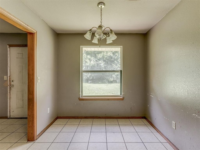 1106 Foggy Bottom Rd, Tecumseh, OK 74873 - spare room with a chandelier and light tile patterned floors