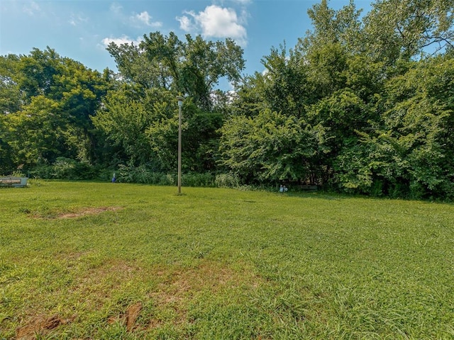 1106 Foggy Bottom Rd, Tecumseh, OK 74873 - view of green lawn featuring a wooded view