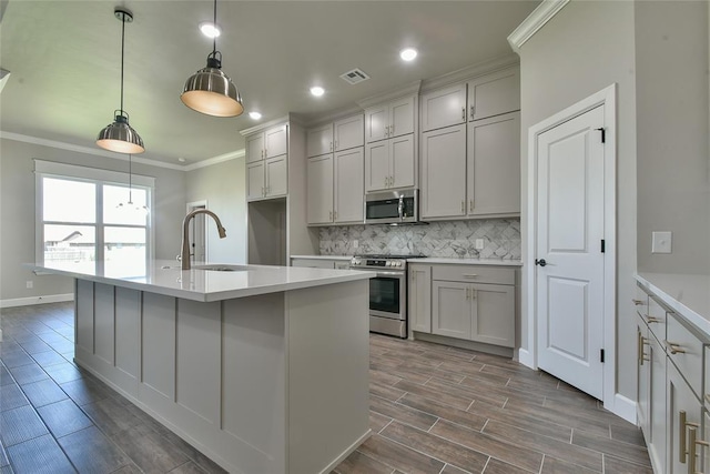 10617 Little Sallisaw Creek Dr, Yukon, OK 73099 - kitchen with stainless steel appliances, crown molding, tasteful backsplash, recessed lighting, and light countertops