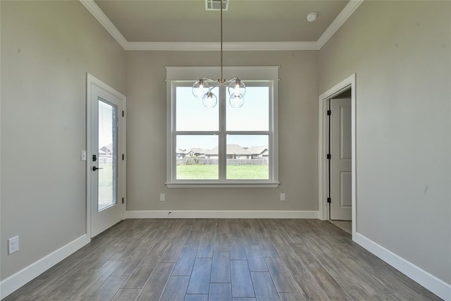 10617 Little Sallisaw Creek Dr, Yukon, OK 73099 - unfurnished dining area featuring ornamental molding, a chandelier, and dark wood-style flooring