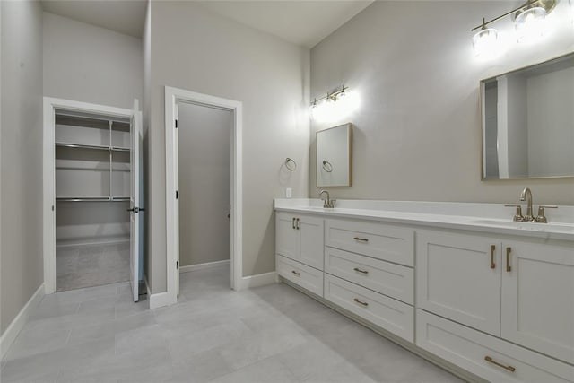 10617 Little Sallisaw Creek Dr, Yukon, OK 73099 - full bathroom with double vanity, tile patterned floors, and a spacious closet