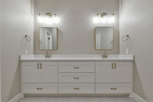 10617 Little Sallisaw Creek Dr, Yukon, OK 73099 - full bathroom with double vanity and baseboards
