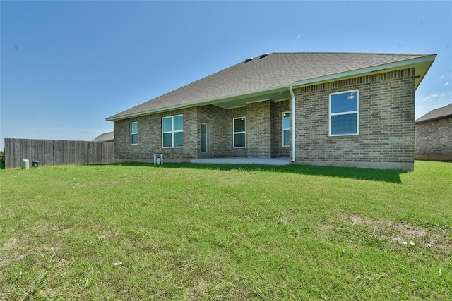 10617 Little Sallisaw Creek Dr, Yukon, OK 73099 - rear view of house featuring a patio, brick siding, and a shingled roof