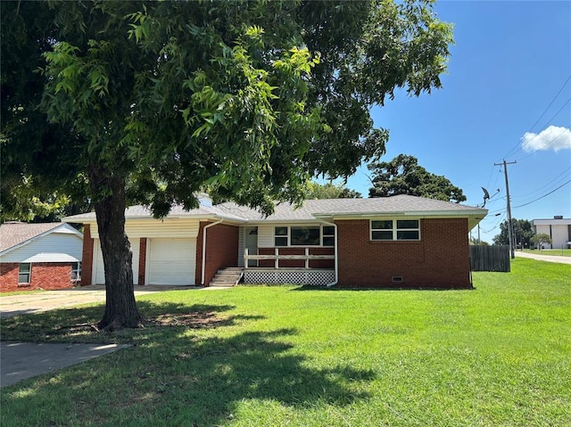 611 Garth Brooks Blvd, Yukon, OK 73099 - ranch-style house featuring brick siding, a garage, a front yard, and driveway