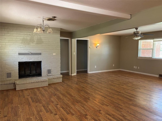 611 Garth Brooks Blvd, Yukon, OK 73099 - unfurnished living room with wood finished floors, beam ceiling, a ceiling fan, and a fireplace