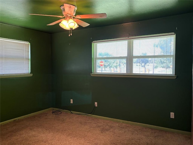 611 Garth Brooks Blvd, Yukon, OK 73099 - empty room with carpet and a ceiling fan