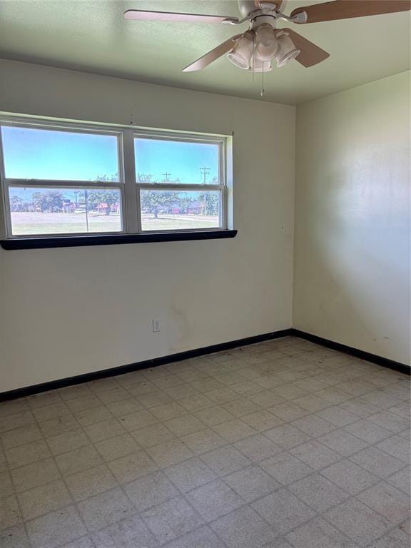 611 Garth Brooks Blvd, Yukon, OK 73099 - unfurnished room with a ceiling fan and light floors