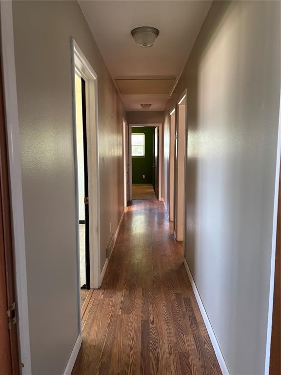611 Garth Brooks Blvd, Yukon, OK 73099 - hall with wood finished floors and baseboards