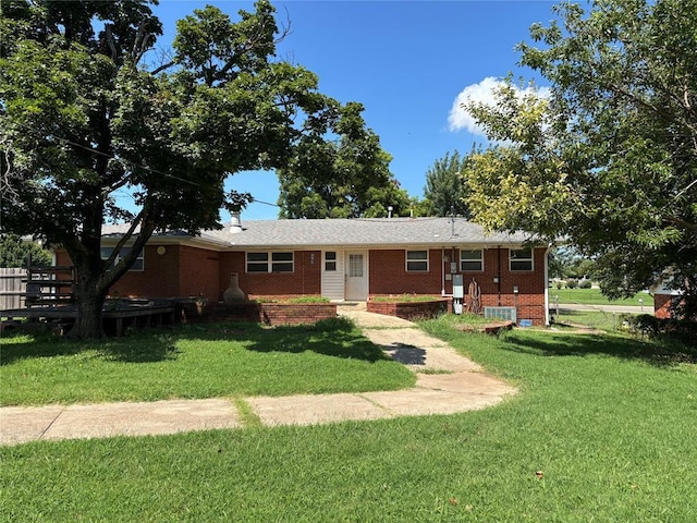 611 Garth Brooks Blvd, Yukon, OK 73099 - view of front of house featuring brick siding and a front yard