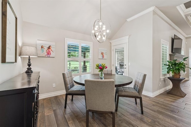 8040 Sweetgum St, Edmond, OK 73034 - dining area with dark wood-style flooring, a chandelier, and vaulted ceiling