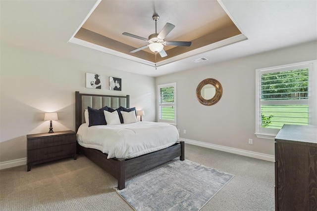 8040 Sweetgum St, Edmond, OK 73034 - bedroom featuring a raised ceiling, carpet, and ceiling fan