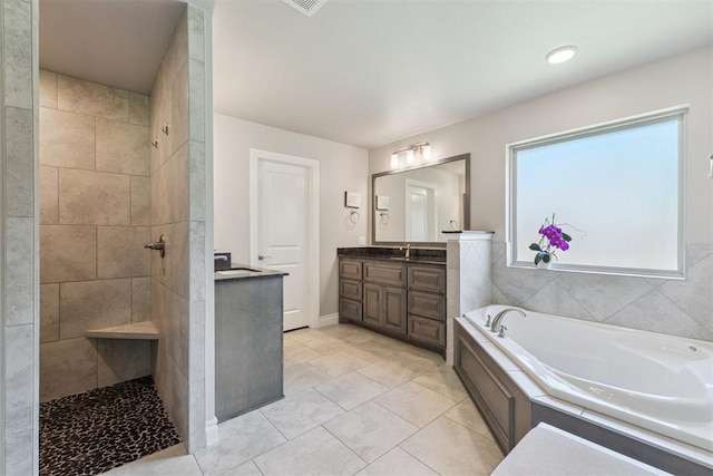 8040 Sweetgum St, Edmond, OK 73034 - full bath featuring vanity, a bath, walk in shower, and tile patterned flooring