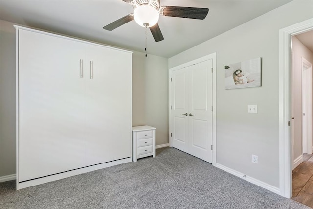 8040 Sweetgum St, Edmond, OK 73034 - unfurnished bedroom with carpet floors, a closet, and a ceiling fan