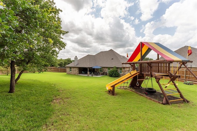 8040 Sweetgum St, Edmond, OK 73034 - fenced backyard with a playground
