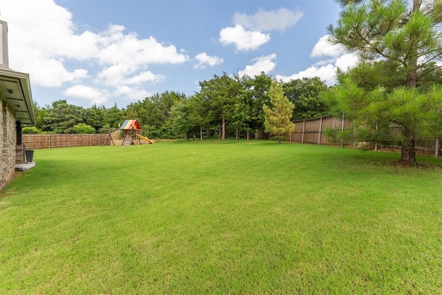 8040 Sweetgum St, Edmond, OK 73034 - fenced backyard with a playground