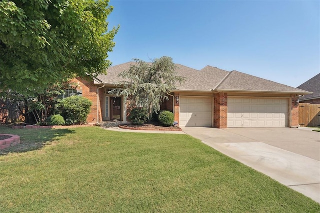 3343 Teton Cir, Norman, OK 73072 - view of front of property featuring brick siding, a garage, concrete driveway, and a shingled roof