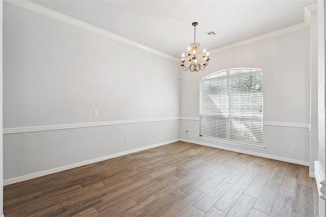 3343 Teton Cir, Norman, OK 73072 - empty room with a chandelier, wood finished floors, and crown molding