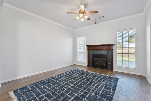 3343 Teton Cir, Norman, OK 73072 - unfurnished living room featuring wood finished floors, ceiling fan, ornamental molding, and a tile fireplace