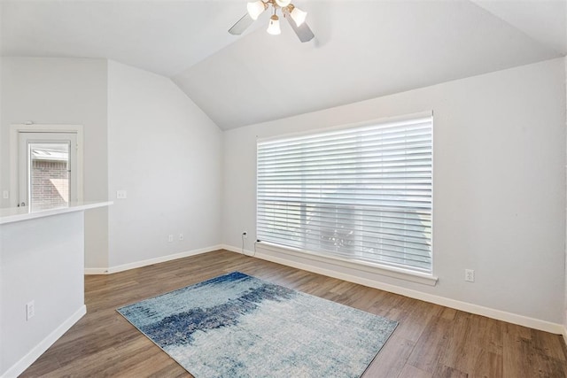 3343 Teton Cir, Norman, OK 73072 - empty room featuring vaulted ceiling, a ceiling fan, and wood finished floors