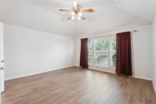 3343 Teton Cir, Norman, OK 73072 - unfurnished room with lofted ceiling, wood finished floors, and a ceiling fan