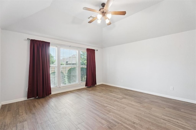 3343 Teton Cir, Norman, OK 73072 - unfurnished room with vaulted ceiling, wood finished floors, and ceiling fan