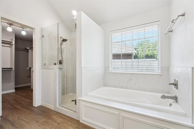 3343 Teton Cir, Norman, OK 73072 - full bath with a garden tub, a marble finish shower, a spacious closet, and wood finished floors