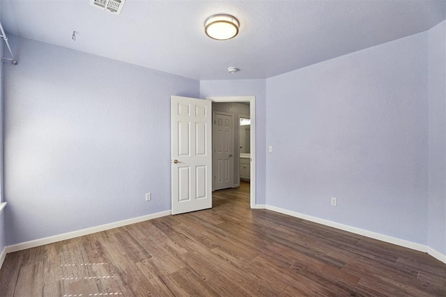 3343 Teton Cir, Norman, OK 73072 - unfurnished room with baseboards and wood finished floors