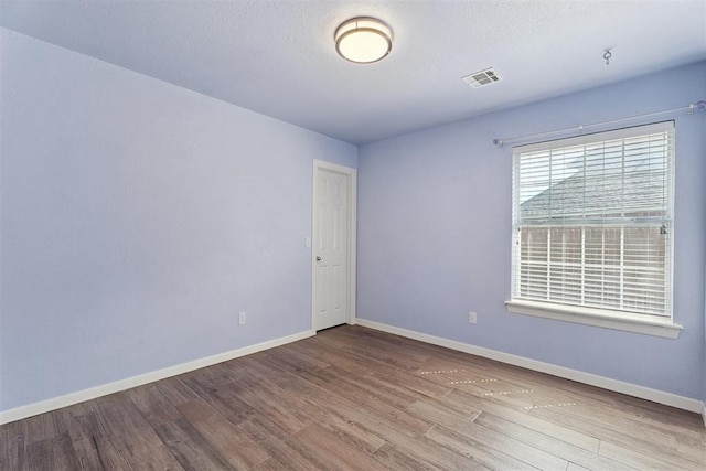 3343 Teton Cir, Norman, OK 73072 - empty room with wood finished floors and baseboards