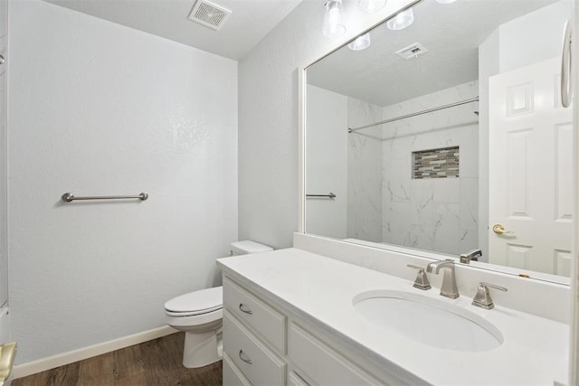 3343 Teton Cir, Norman, OK 73072 - full bath with wood finished floors, vanity, a shower, and a textured wall