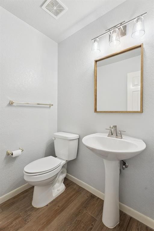 3343 Teton Cir, Norman, OK 73072 - half bath featuring wood finished floors and toilet