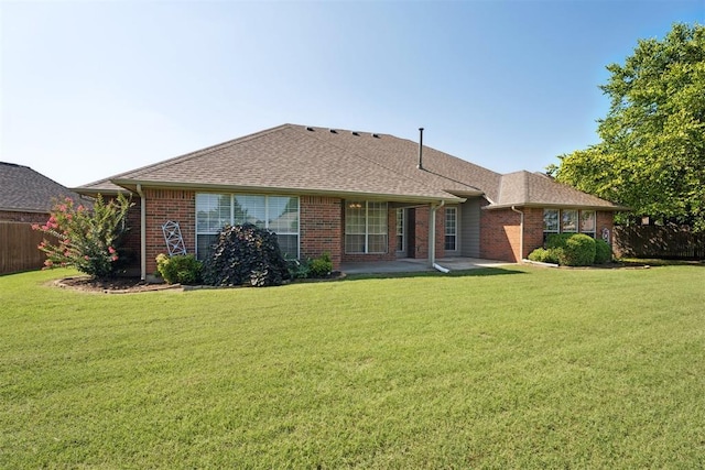 3343 Teton Cir, Norman, OK 73072 - back of house featuring brick siding, a patio, and roof with shingles