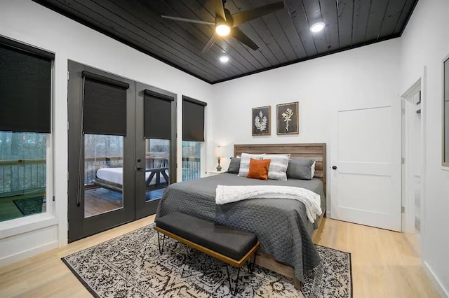 156 Butternut Trl, Broken Bow, OK 74728 - bedroom featuring french doors, wood finished floors, wooden ceiling, and a ceiling fan