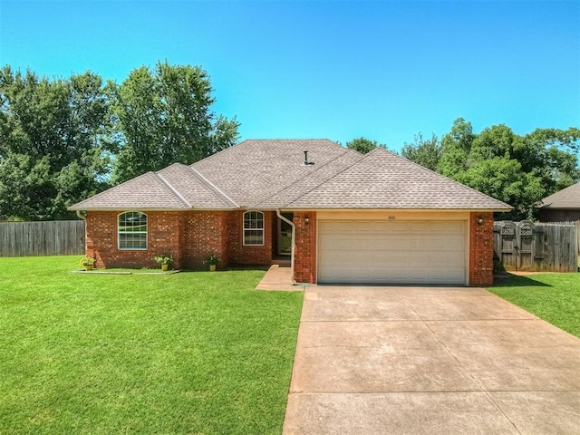 400 Ryan Way, Edmond, OK 73003 - ranch-style house with concrete driveway, an attached garage, brick siding, and roof with shingles