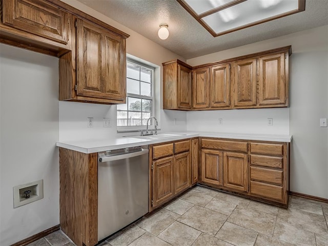 400 Ryan Way, Edmond, OK 73003 - kitchen with dishwasher, brown cabinetry, and light countertops