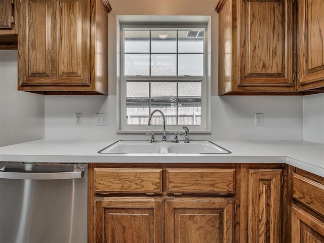 400 Ryan Way, Edmond, OK 73003 - kitchen featuring dishwasher, light countertops, and brown cabinetry