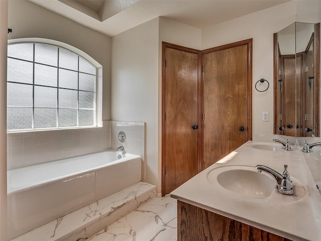 400 Ryan Way, Edmond, OK 73003 - full bath with marble finish floors, double vanity, and a garden tub