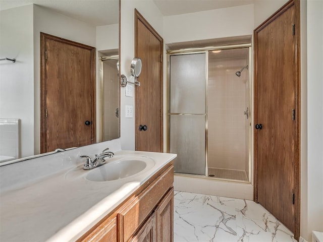 400 Ryan Way, Edmond, OK 73003 - full bath featuring a shower stall, vanity, and marble finish flooring