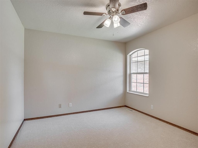 400 Ryan Way, Edmond, OK 73003 - unfurnished room with carpet flooring, a textured ceiling, and a ceiling fan