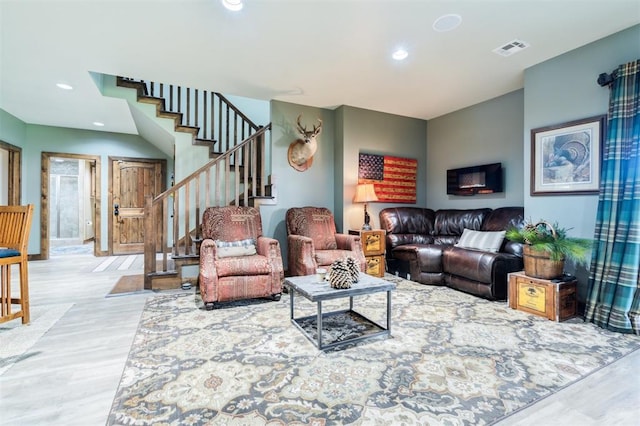 39 E Shore Dr, Arcadia, OK 73007 - living room with wood finished floors, stairway, and recessed lighting