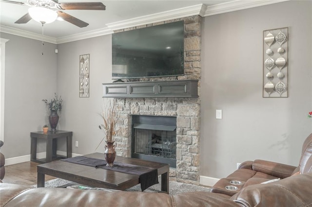 9409 NW 91st St, Yukon, OK 73099 - living area featuring ceiling fan, crown molding, a fireplace, and wood finished floors