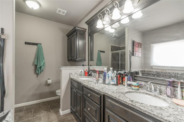 9409 NW 91st St, Yukon, OK 73099 - bathroom with a shower stall and double vanity