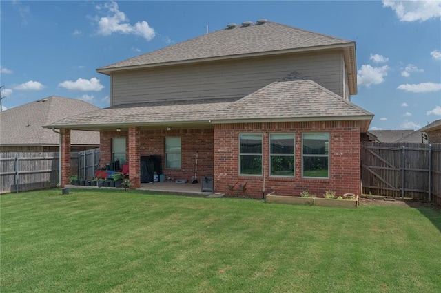 9409 NW 91st St, Yukon, OK 73099 - back of house featuring a fenced backyard, a patio area, a shingled roof, and brick siding
