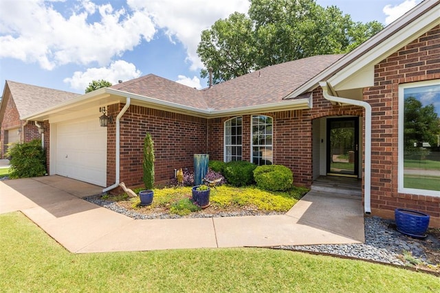 812 Old Bugle Rd, Edmond, OK 73003 - view of front facade featuring brick siding, a garage, a shingled roof, and concrete driveway