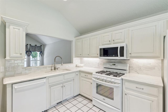 812 Old Bugle Rd, Edmond, OK 73003 - kitchen featuring white appliances, lofted ceiling, tasteful backsplash, white cabinetry, and light tile patterned floors