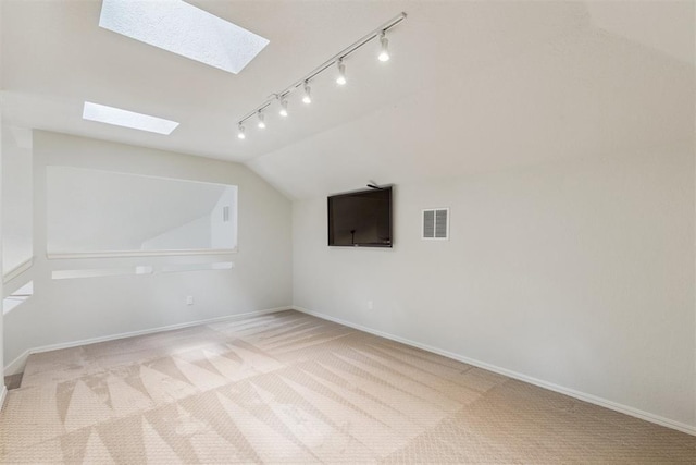 812 Old Bugle Rd, Edmond, OK 73003 - bonus room with a skylight, carpet flooring, and vaulted ceiling