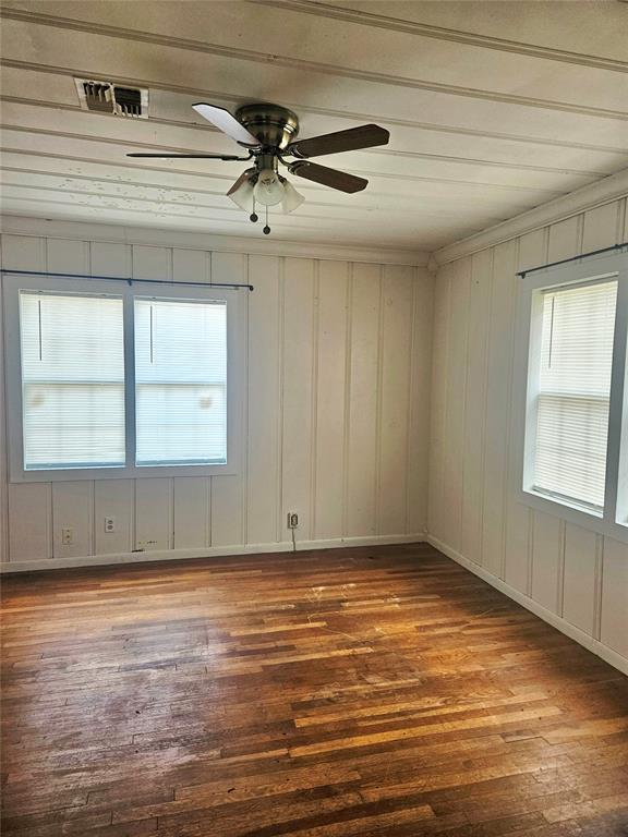 934 E Elm St, Altus, OK 73521 - spare room with hardwood / wood-style floors and ceiling fan